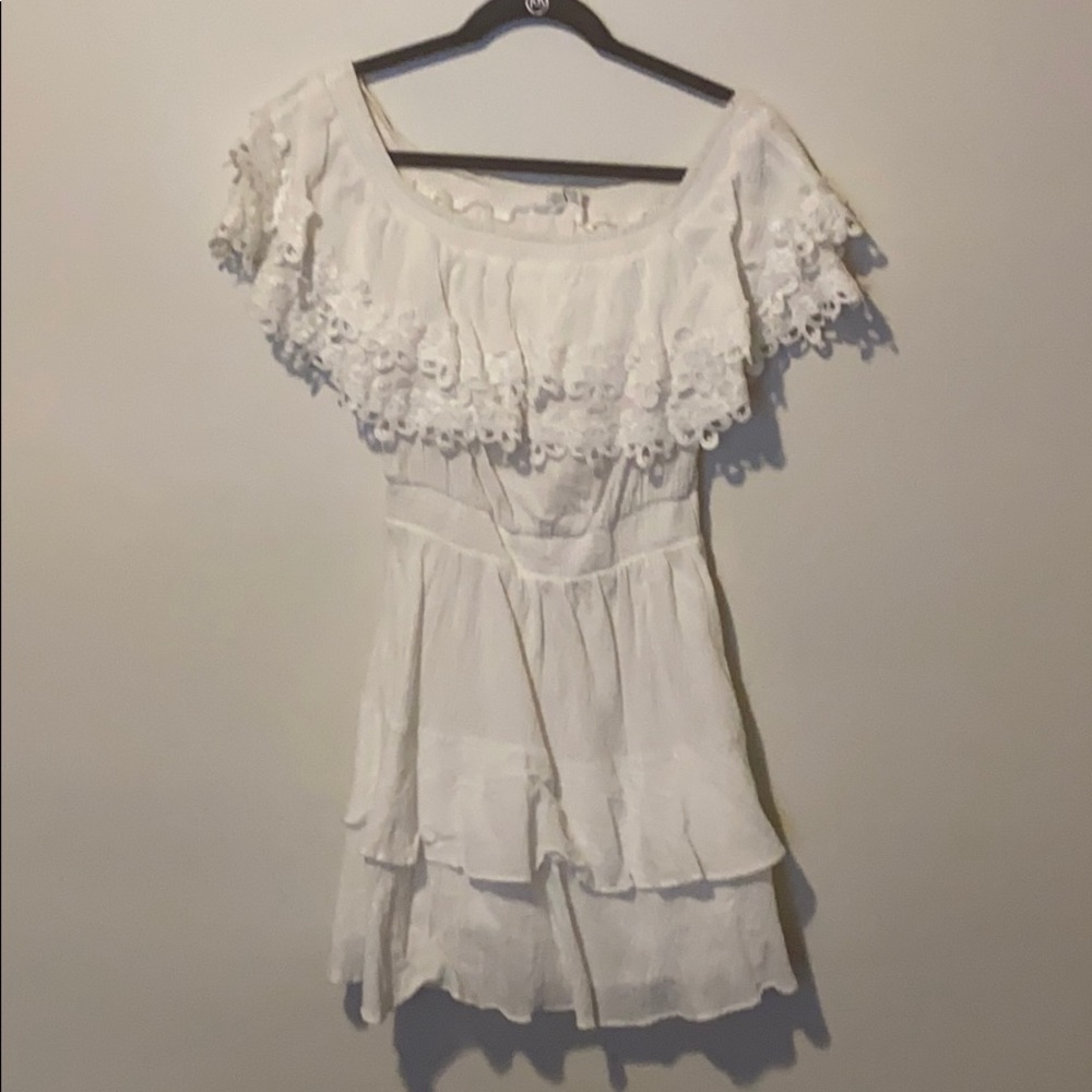 Short, white ruffled summer dress